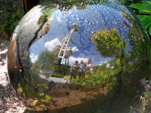 the two RV Gypsies' reflection with the Seattle Space Needle